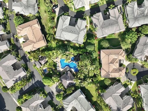 Bird's eye view of your private pool oasis surrounded by tropical gardens
