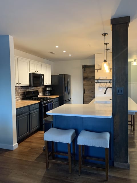 Butcher block and fully equipped kitchen.