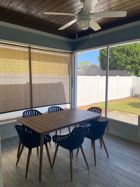 Screened in lanai with outdoor dining table