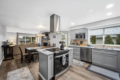 Cook memorable meals in your spacious kitchen featuring granite countertops, stainless steel appliances, and island seating for casual dining.