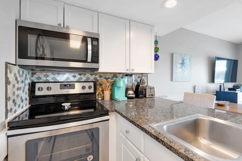 Stainless Appliances and Lovely Tilework