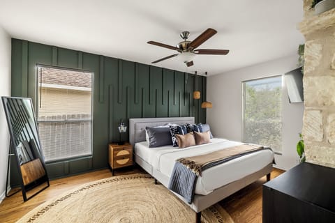 The master bedroom boasts a luxurious king-sized bed, a private ensuite bathroom, and a spacious walk-in closet for ultimate comfort and convenience.