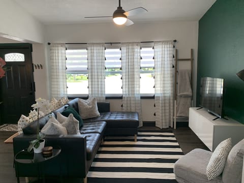 open concept living room (view from kitchen) vaulted ceilings makes it airy