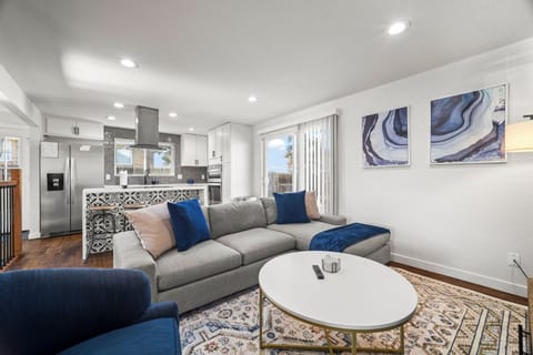 Upstairs living room, bright and cozy, perfect for groups to unwind together.