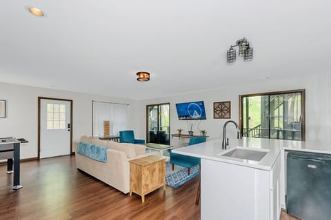 55 inch TV, foosball table, and Jenga! Walk out to the hot tub on the deck.