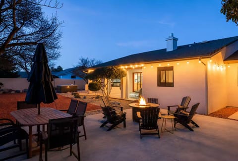 Outdoor dining table and seating area with propane fire-pit. 