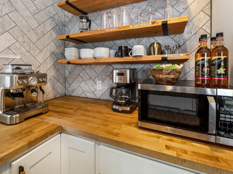 In addition to the teapot, French press and coffee maker, craft your own cafe-style drinks with a Barista Espresso machine. A coffee grinder is supplied as well as whole espresso beans in addition to a few flavored syrups.