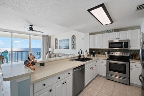 The fully equipped kitchen features quartz countertops, stainless-steel appliances, and has everything you need to prepare meals for family & friends.