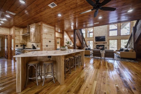The kitchen island has 6 bar stools and the table seats up to 12 as well.