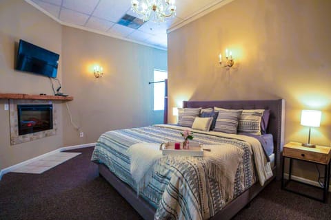 Stretch out on the king size bed and take in a movie and a fire