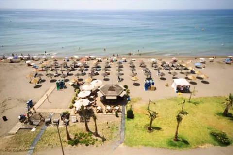 On the beach, sun loungers, beach umbrellas, beach towels