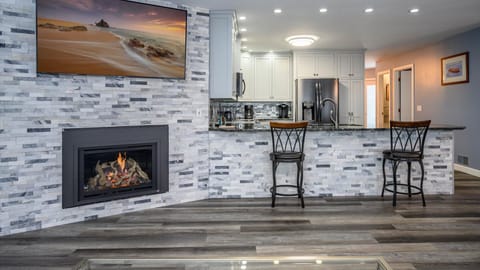 Gas fireplace offers a cozy spot to gather on the chillier days.