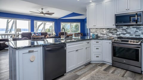 Well appointed kitchen has dishwasher for easy vacation clean up. Look over the Lake while preparing your home cooked meals.