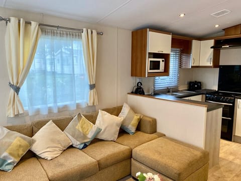 Cosy sofa with kitchen behind