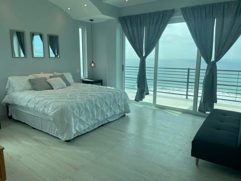 Oceanfront master bedrooms, triple stacking doors, that open. 