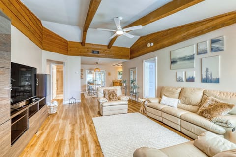 Elegant living area featuring exposed wood beams and cozy seating.