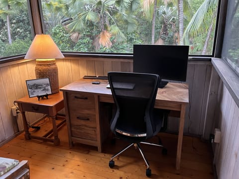 Office alcove with 25" monitor, standard keyboard, mouse and docking station.