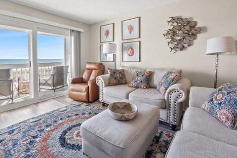 Living area with sectional seating, a recliner and ocean views at Coastal Shores C2 on Ocean Drive