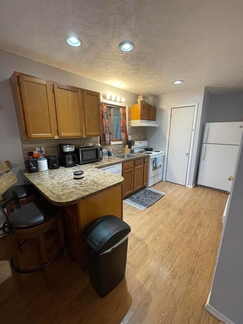 Kitchen with stove refrigerator and other daily use items 