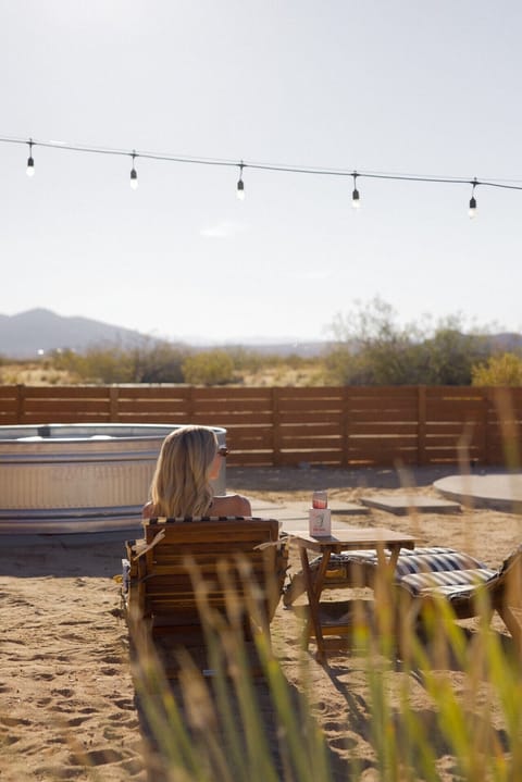 Lounge chairs overlooking the desert + pool