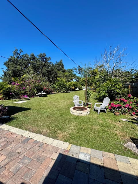 Backyard on a clear sunny day, full fenced with privacy