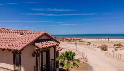 Located in the gated El Dorado Ranch community with private beach, golf course, and pools .