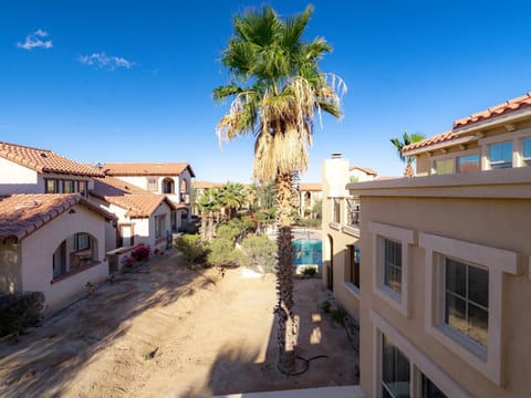 2-bedroom, 2-bath poolside condo. 1st floor has a king bed with a walk-in shower; 2nd floor has a queen bed.