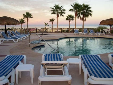 Playa de Oro features two community swimming pools: a 62' lap pool and a 43' designer pool, plus a 10-person hot tub . Located near La Vaquita Norte Seafood Restaurant and open to guests with HOA access