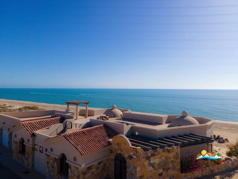 See the full property from behind with the Sea of Cortez in the distance — drone shot of Casa Serenity in San Felipe.