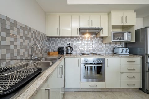 Village Residence | Private kitchen | Fridge, electric kettle