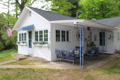 Front view of the Little White Cottage.  Entrance to the cottage from the porch.