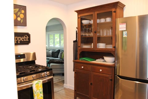 View from the mudroom into the kitchen with a view of the living/dining room 