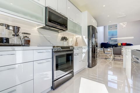 Top-of-the-line appliances include an electric range & smart refrigerator