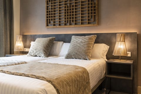 Down comforters, memory foam beds, laptop workspace, soundproofing