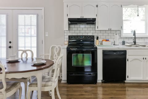 Bright white cabinets in the kitchen.
