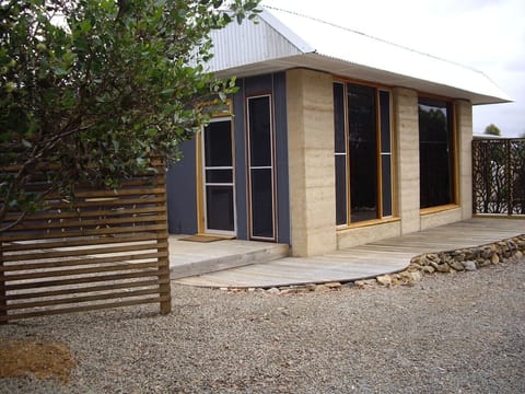 Rammed Earth walls and repurposed materials make this guest house unique