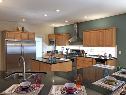 Kitchen is a dream for home cooks preparing for large gatherings.  Extra-Large capacity refrigerator and freezer, separate wine refrig, 2 sinks.