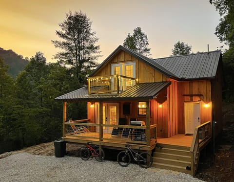 This photo shows the cabin's covered deck and master bedroom balcony.