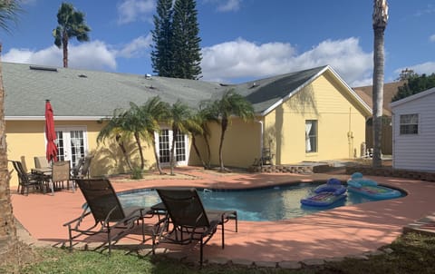 Soak in the sun poolside with your favorite ice cold drink next to you.