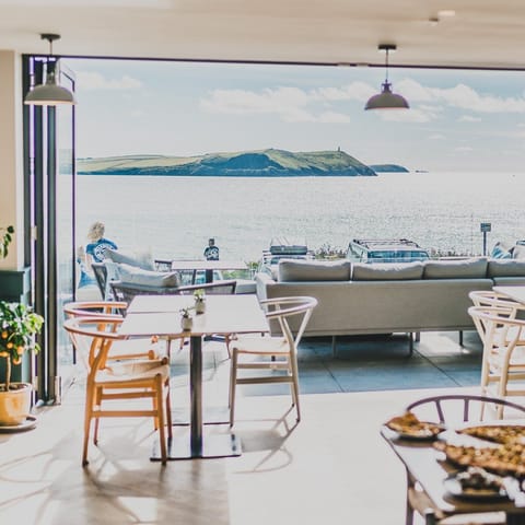 Breakfast, lunch, dinner served; beach views