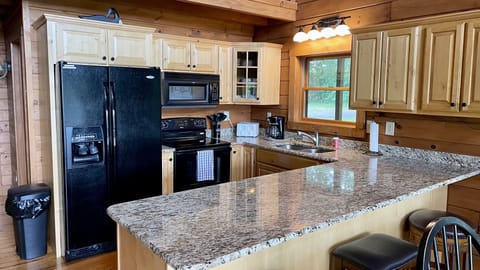 The kitchen is stocked with all the utensils and appliances you need!