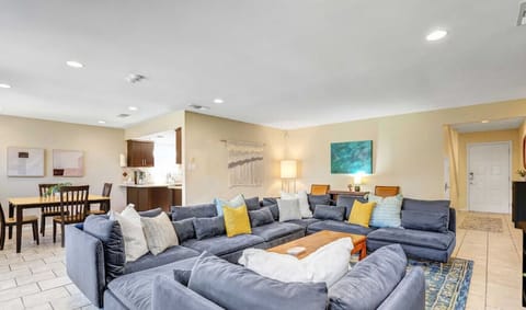 Super cozy living room with massive modular sofa, fireplace, & smart tv