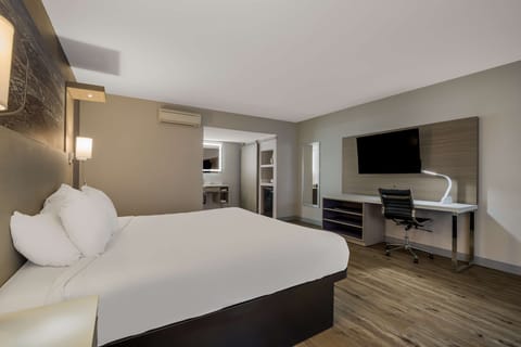 Desk, laptop workspace, blackout drapes, iron/ironing board