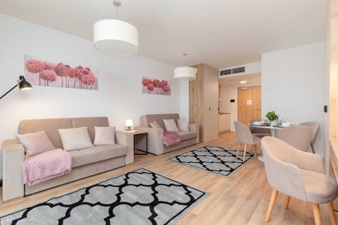 Relax in the stylish living room with comfortable sofas and cozy decor.