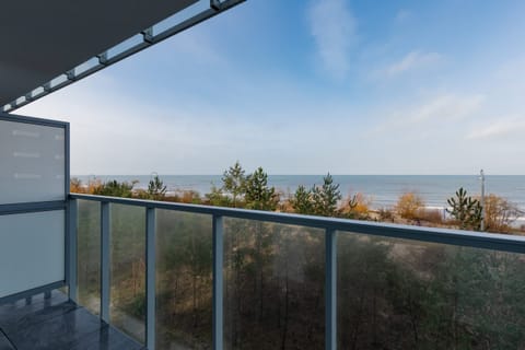 The balcony provides a serene environment for relaxation. 