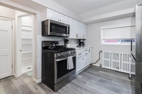 Off of kitchen is basement laundry area and bathroom 1.