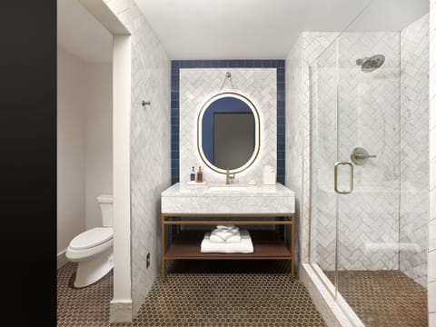 Designer toiletries, hair dryer, bathrobes, slippers