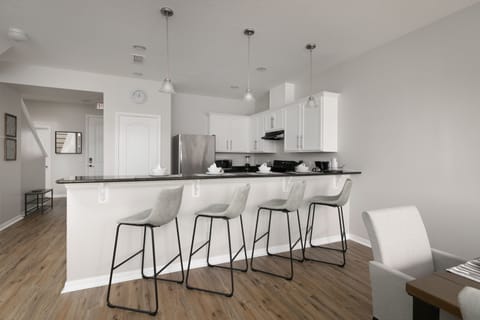 Gather around our modern kitchen island with comfy stools for snacks or chats.