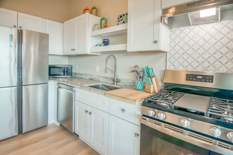 Beautiful stainless steel appliances with gas range.