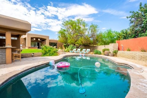 Relax by the private pool surrounded by desert landscaping and comfortable lounge chairs.